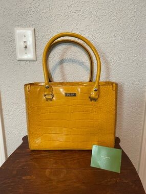 Kate Spade satchel. Sunny gold crocodile  leather with lots of room!